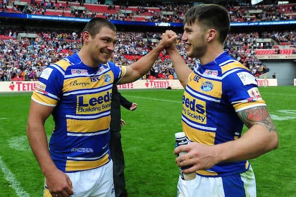 Wingers Ryan Hall, left and Tom Briscoe celebrate Rhinos' 2014 Cup final win over Castleford. They could be on opposite sides at Wembley next month. Picture by Alex Broadway/SWpix.com.