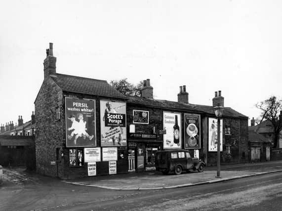 Cross Gates Road in February 1956 showing the premises of W and H Aspinall.