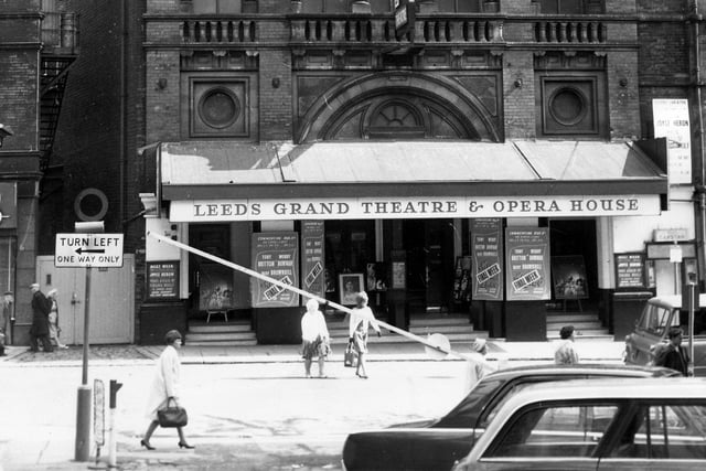This photo shows the main entrance of the Grand Theatre on New Briggate in August 1966. Playbills advertising the current show, 'My Fair Lady', are visible. This show ran from the 11th August for three weeks and three days, finishing on the 28th. Additional signs state that this show is in its final week. A large poster to the right advertises Joyce Heron in 'Who's Afraid of Virginia Woolf', starting on September 5.