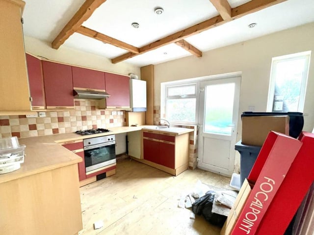 Considering the house could do with a facelift, the kitchen looks far from forlorn. It is a good size too.