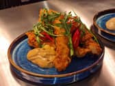 The menu at the Wonky Donkey includes dishes like chicken in a homemade coating.