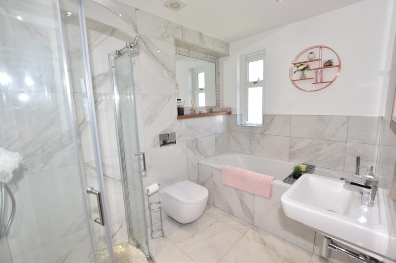 The family bathroom is fitted with bath, WC, hand wash basin and separate shower cubicle.