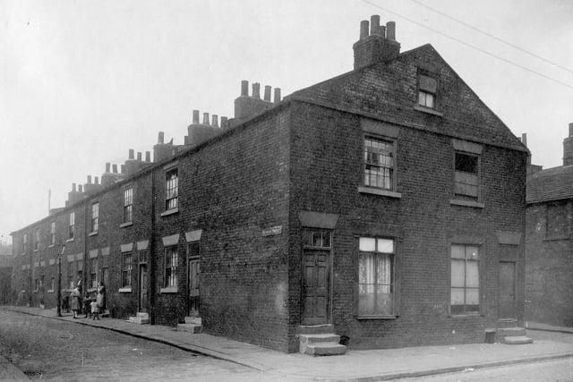 Looking down Humane Street from Low Road, row of two storey terrace houses. Next junction to right is with Society Street.