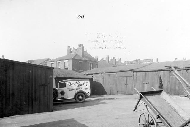 This is the yard of 75 Stoney Rock Lane the home of Stephen and Maud Coates who ran Coates Dairy. In the yard in the foreground is a small van belonging to the dairy. The photograph is taken from the house and the end of Fraser Street can be seen in the background. Pictured in September 1935.