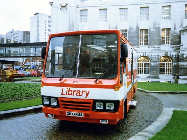 One of Leeds City Libraries' Mobile Libraries on the circular roadway in the grounds to the rear of the Civic Hall, taken when the mobile was new in 1989. The glass bridge linking the Civic Hall to its Annexe can be seen to the left. The tall building partly visible behind this is Leeds College of Technology.