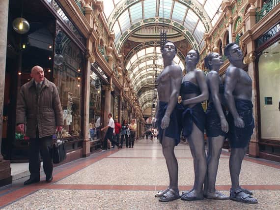 Living statues stop the shoppers in Leeds city centre as part of the opening of the Blue Bar Cafe, in Swan Street, in 2005.