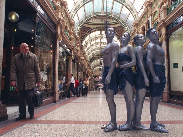 Living statues stop the shoppers in Leeds city centre as part of the opening of the Blue Bar Cafe, in Swan Street, in 2005.