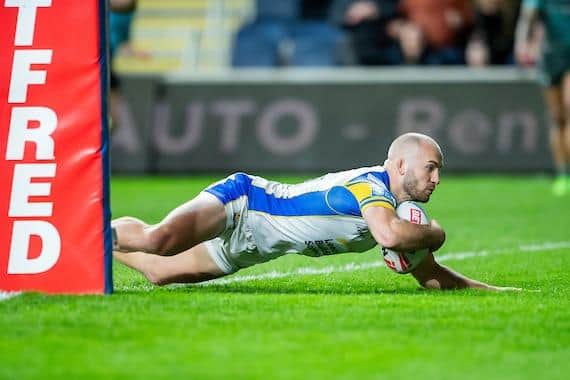 Jarrod O'Connor touches down for Leeds Rhinos against Huddersfield Giants. Picture by Allan McKenzie/SWpix.com .