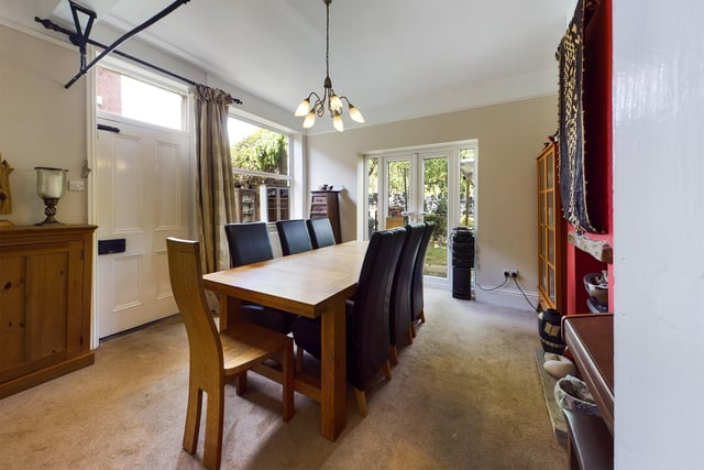 This sizeable room has an electric fire, and doors leading out to the garden.