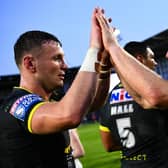 Harry Newman, left, celebrates with teammate Lachie Miller following Leeds Rhinos' win at Warrington Wolves. Picture by Olly Hassell/SWpix.com.
