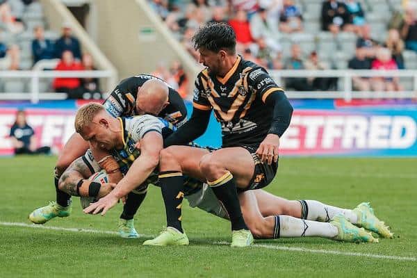 Mikolaj Oledzki scores for Rhinos in their Magic Weekend loss to Castleford. Picture by Alex Whitehead/SWpix.com.