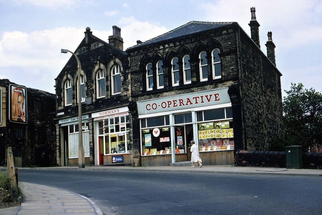 The Church Street branch of Morley Co-op pictured in August 1967. This was built in two sections, one part in the 1880s which by this time had been converted into a small Co-op supermarket and the other part in 1914. The part here named Norman's (Norman Dance, an East Ardsley hairdresser who moved here after his shop in the Falls was demolished under slum clearance orders) was originally a Co-op butchers. The part named Linda's Ladies Hair Stylist was originally the Co-op greengrocers which had a round of regular Friday deliveries by horse and cart. To the left of this is the entrance to Croft House, birthplace of former prime minister H. H. Asquith.