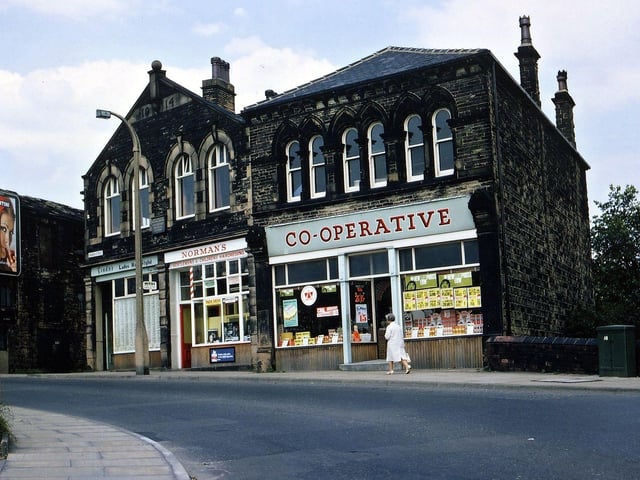 The Church Street branch of Morley Co-op pictured in August 1967. This was built in two sections, one part in the 1880s which by this time had been converted into a small Co-op supermarket and the other part in 1914. The part here named Norman's (Norman Dance, an East Ardsley hairdresser who moved here after his shop in the Falls was demolished under slum clearance orders) was originally a Co-op butchers.