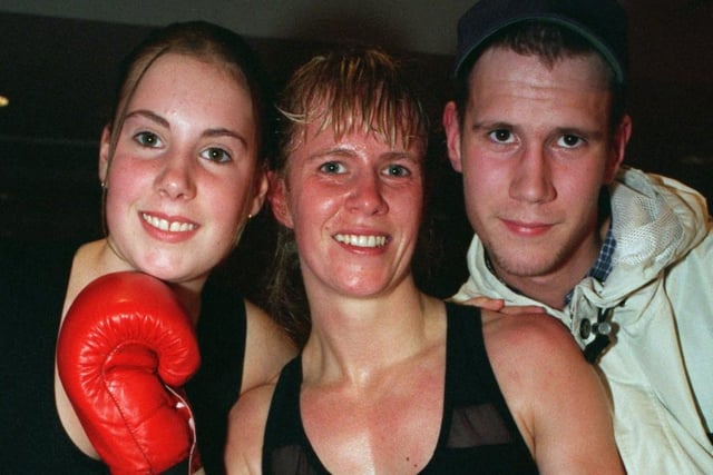 Boxer Michelle Sutcliffe celebrates her children after being crowned WIBF International Flyweight Champion. She defeated Veerle Braspenningx of Belgium in the bout held at the Royal Armouries.