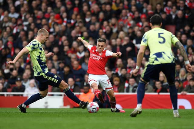 'MIDFIELD WRECKER': Leeds United's Rasmus Kristensen, left, challenging Arsenal's Leandro Trossard in Saturday's clash at The Emirates. Photo by David Price/Arsenal FC via Getty Images.