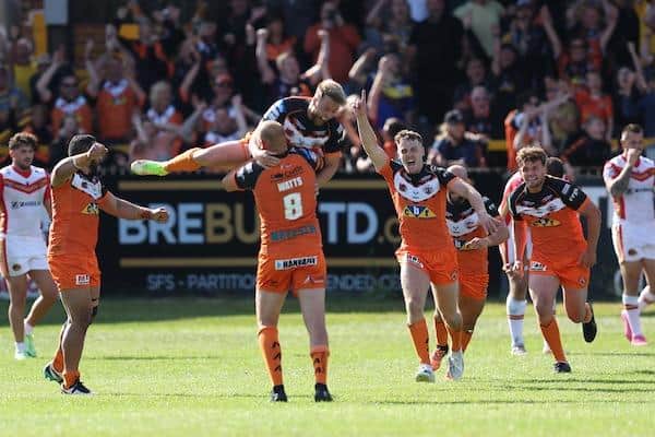 Tigers players celebrate Danny Richardson's drop goal which secured an extra-time win over Catalans. Picture by John Clifton/SWpix.com.