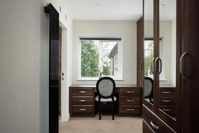 The master bedroom also boasts a walk through dressing area
