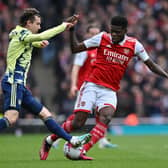 VOW: From Leeds United's Brenden Aaronson, left, pictured challenging Arsenal's Thomas Partey in Saturday's 4-1 defeat at the Emirates. 
Photo by GLYN KIRK/AFP via Getty Images.
