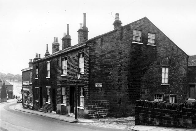 This is looking down Delph Lane, across Woodhouse Street to Rampart Road and Woodhouse Moor, all just visible on the left. On Delph Lane, number 7 is the newsagents shop. Moving right are numbers 9, 11 & 13. Holroyds Yard is next, off Dairy Street. Pictured in September 1959.