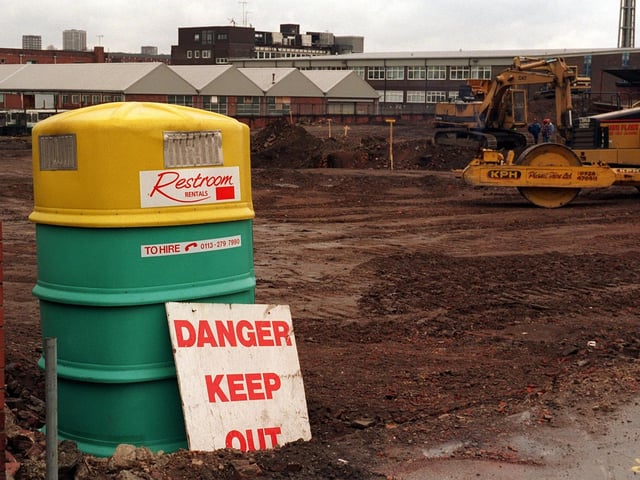 New building regulations do not include dangerous toilets. But the want of somewhere to rest a " keep out " sign to this building site in Burley Road on March 1997 giving  passers by the impression that it's the portable toilet which was the danger area.
