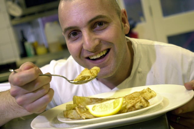 Chef Simon Gueller, pictured eating one of the pancakes he has prepared at a Leeds city centre restaurant.
