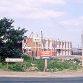 Howley Park Road and the entrance to Howley Park Trading Estate pictured in June 1970. At this time the M62 Lancashire-Yorkshire motorway was just being built. The largest building in the photograph is a warehouse for DCL (Distillers Company Limited).