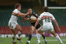 Ryan Hall seen during his Leeds Rhinos debut at the first Magic Weekend in 2007. The Bradford Bulls players tackling him are present Rhinos assistant-coach Jamie Langley and Sam Burgess, now in charge of Warrington Wolves. Picture by Steve Riding.
