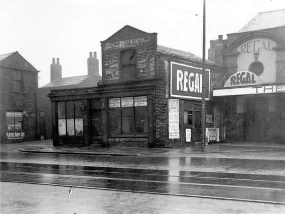 Regal cinema, formerly called the Pavillion, on Low Road pictured in July 1935. On the left is the entrance to Organ Yard.  Premises on left is formerly Whitehall garage.