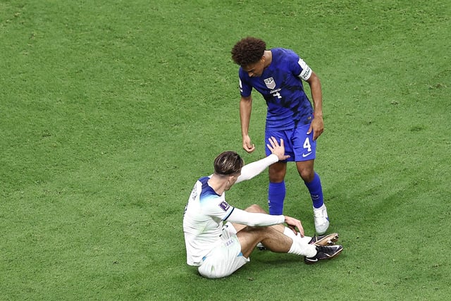 Adams attempts to help England's Jack Grealish to his feet during the US's stalemate with England (Photo by Tim Nwachukwu/Getty Images)