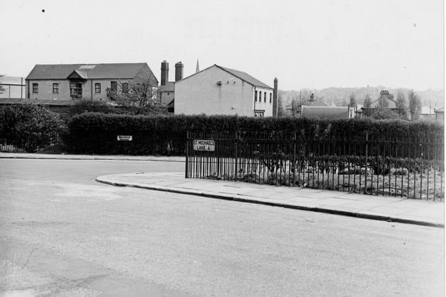 The junction of St. Michael's Lane and Beechwood Crescent. The edge of an allotment site can be seen on the left with houses in the background. Pictured in August 1949.