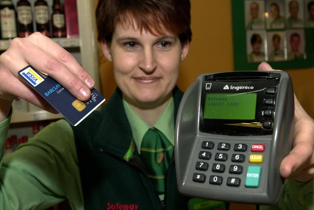 Safeway checkout manager Sam Robins, pictured with the new chip and pin machine at their city centre store on February 12, 2004.