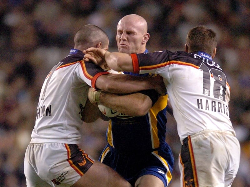 He's got no hair, but he was everywhere: Rhinos' Keith Senior runs into Bradford Bulls defenders Stuart Reardon and Iestyn Harris.