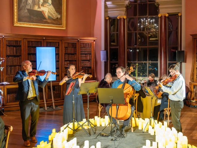 A candle-lit string quartet performed captivating music throughout the evening