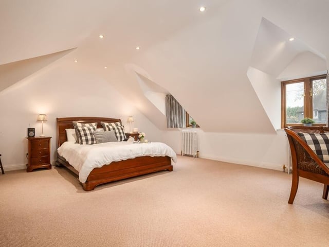 One of five individually styled bedrooms.
