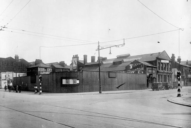The  junction of Meadow Lane (left) with Great Wilson Street in Holbeck. Area on corner has builders hoarding surrounding cleared area. H.E. Donal Ltd, Brass founders can be seen at 22 Great Wilson Street. Pictured in July 1932.