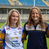 Rhinos coach Lois Forsell flanked by new signings Liv Whitehead, left and Grace Field. Picture by Leanne Flynn/Leeds Rhinos.