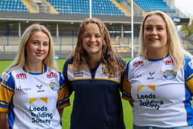 Rhinos coach Lois Forsell flanked by new signings Liv Whitehead, left and Grace Field. Picture by Leanne Flynn/Leeds Rhinos.