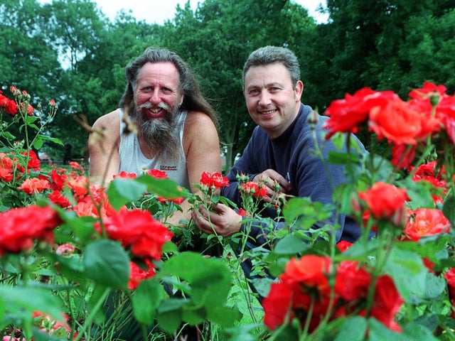 Leeds City Council workers Mick Atkinson and Timothy Nye put some finishing touches to Britain in bloom displays in Cross Flatts Park in September 2002.