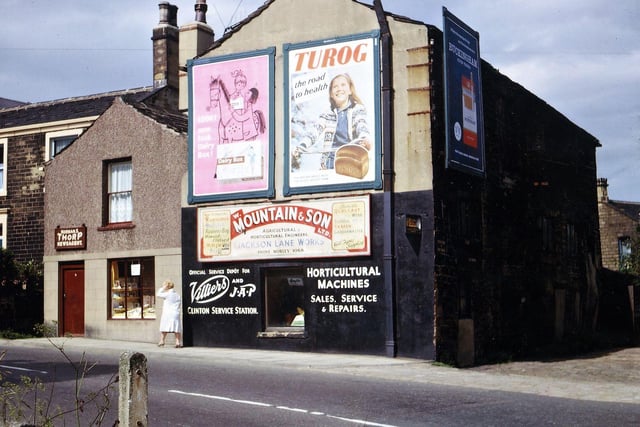 The old warehouse and shop by the side of the entrance to Croft House (birthplace of former prime minister H. H. Asquith) on Church Street in June 1965. The warehouse was supposed to have connections with the woollen industry in Asquith's father's time (perhaps a rag warehouse) but was empty a long time before Bill Mountain took it to start up his horticultural machines business just after the Second World War. His showroom for this was in Jackson Lane, later renamed Bank Avenue, and this was extended when the shop and warehouse shown here were demolished. The newsagents business of Norman Thorp was taken over by Tom Oldfield further along Church Street towards Victoria Road.