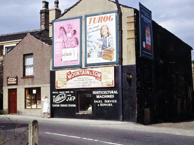 The old warehouse and shop by the side of the entrance to Croft House (birthplace of former prime minister H. H. Asquith) on Church Street in June 1965. The warehouse was supposed to have connections with the woollen industry in Asquith's father's time (perhaps a rag warehouse) but was empty a long time before Bill Mountain took it to start up his horticultural machines business just after the Second World War. His showroom for this was in Jackson Lane, later renamed Bank Avenue, and this was extended when the shop and warehouse shown here were demolished. The newsagents business of Norman Thorp was taken over by Tom Oldfield further along Church Street towards Victoria Road.