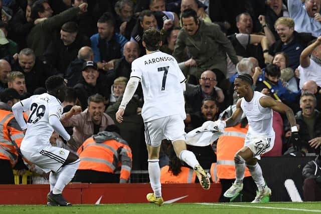 DREAM START: For Leeds United's 18-year-old Italian international forward Willy Gnonto, left, pictured celebrating after setting up the winning goal for Crysencio Summerville, right, in Saturday night's epic 2-1 win at Liverpool. Photo by OLI SCARFF/AFP via Getty Images.