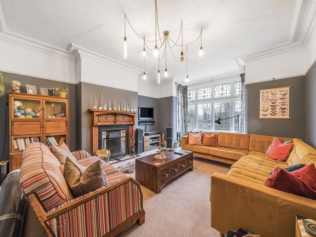 The front reception room on the ground floor is a large living room with beautiful high ceilings, a feature bay window and stunning original windows too.