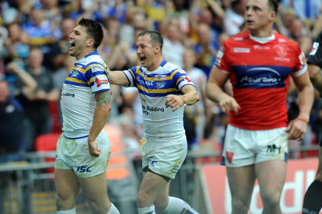 Tom Briscoe celebrates with teammate Danny McGuire after equalling former Leeds flier Leroy Rivett's Wembley record of four tries.
