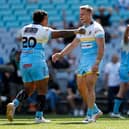 Cooper Jenkins, middle, celebrates North Brisbane Devils' win over Newtown Jets in this year's NRL State Championship. Picture by Cameron Spencer/Getty Images.