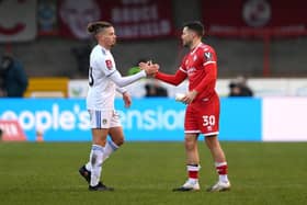 Mark Wright of Crawley Town interacts with Kalvin Phillips of Leeds United. (Photo by Mike Hewitt/Getty Images)