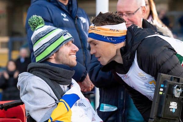 Kevin Sinfield meets Rob Burrow at the Headingley finish line after running 101 miles from Leicester in 24 hours two years ago. Picture by Allan McKenzie/SWpix.com.