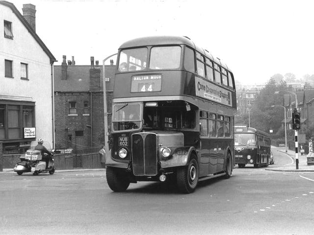 AEC Regent 111/Roe 602 (1950) at the junction of Harehills Lane and Roundhay Road which is to the right in this view. It is the no. 44 route to Halton Moor, registration no. NUB 602. On the left is the business of David Crawford, decorator. Taken in June 1966.