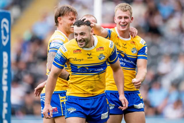 Max Simpson, right, congratulates Jake Connor on his try against Hull FC. Picture by Allan McKenzie/SWpix.com.