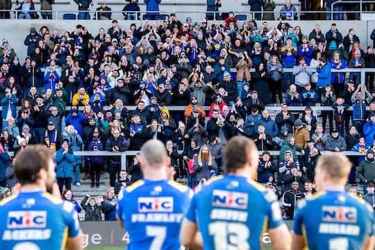 Leeds Rhinos players and fans celebrate last week's win over Catalans Dragons. Picture by Allan McKenzie/SWpix.com.