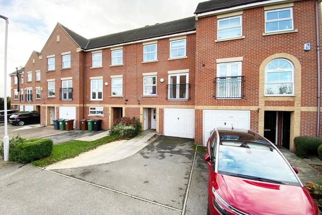 This spacious four bedroom townhouse in Rothwell boasts an open plan kitchen diner and an open plan dining and sitting room. Outside is a large rear garden and driveway laid to tarmac, flags and gravel.